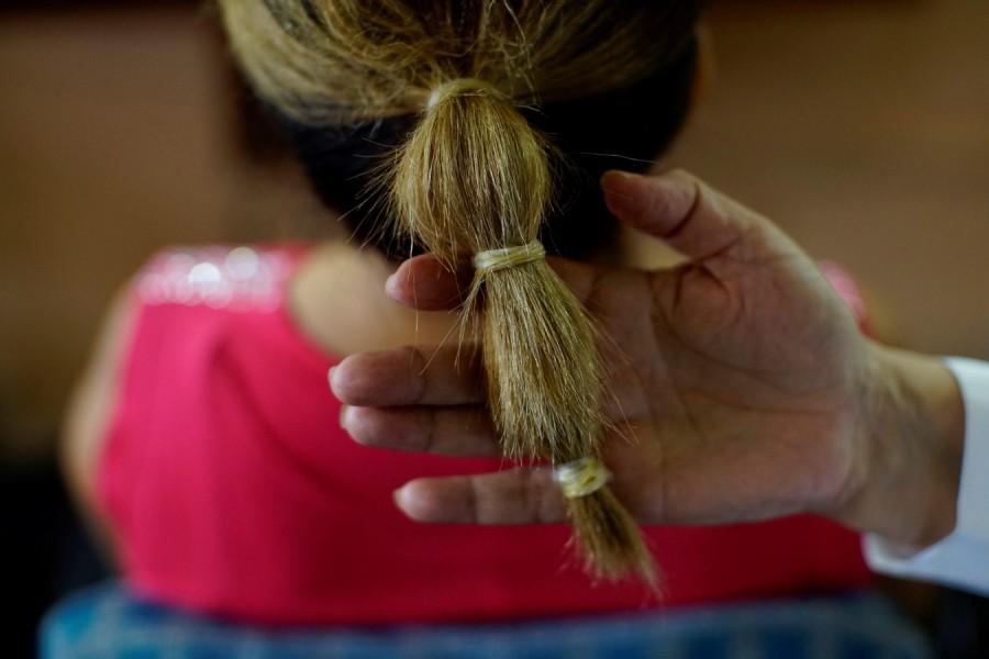 Stylist Sandra Hernandez shows condoms used as as hairbands From fishing to tying hair,Condom Uses,Condom Use,Condom Use Goes Far Beyond Sex,condom usage,Cuba goes far beyond sex