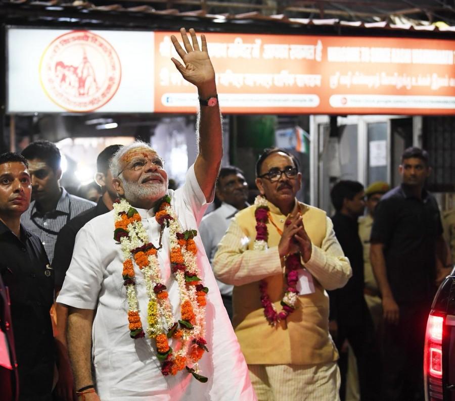 Narendra Modi waves to the photographers Narendra Modi,PM Narendra Modi,Narendra Modi at Kashi Viswanath temple,Kashi Viswanath temple,Narendra Modi birthday celebration,Narendra Modi birthday pics,Narendra Modi birthday images,Narendra Modi birthday stills,Narendra Modi birthday pictures,Narend